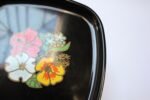 Mid-Century Black Resin Inlaid "Flowers" Plate by Couroc for Western Airlines - Image 6