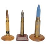 Set of Three Vintage Trench Art Bullet Casing Paperweights and Flint Lighter