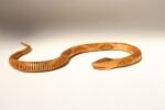 Long Folk Art Articulated Flexible Carved and Hand-Painted Snake Sculpture - Image 2