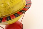 Vintage Replogle Yellow and Red Tin Litho "Globe Grams' Spinning World Globe - Image 12